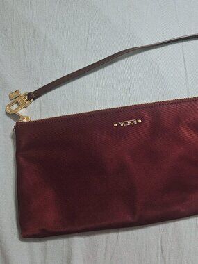 Tumi burgandy red clutch bag